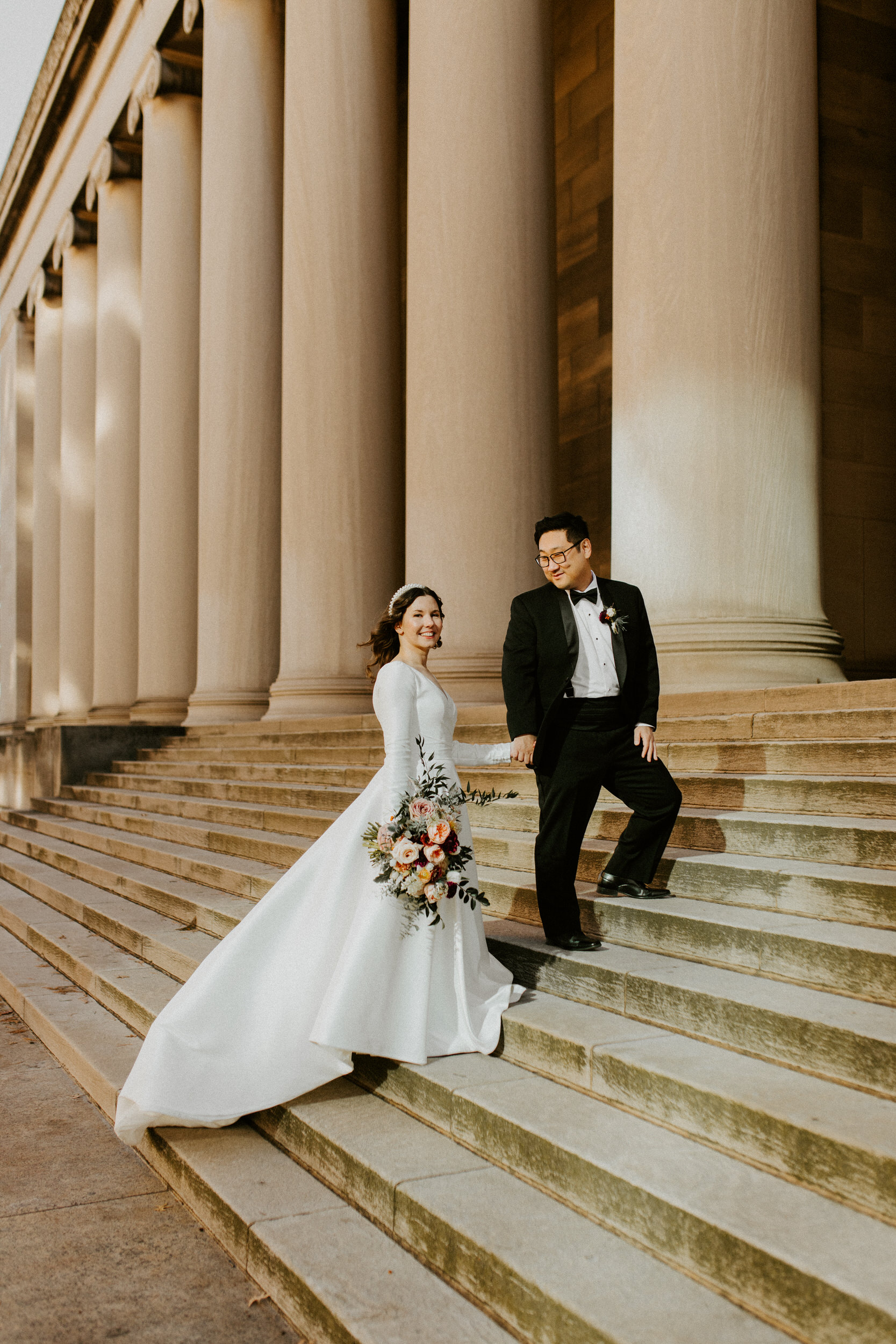 bride and groom on steps of the mellon institute